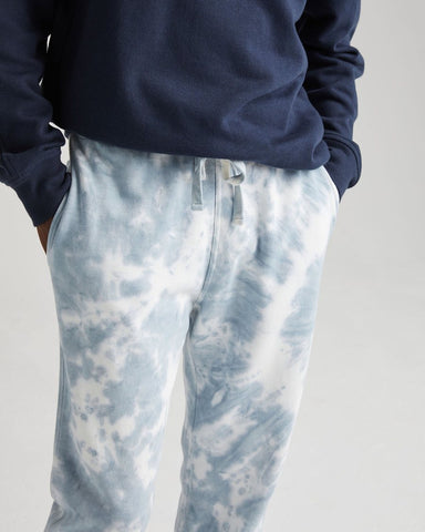 Comfortable, Classic Fit Sweatpant with Side Seam Pockets and Back Patch Pocket. Made from 60% Cotton, 40% Recycled Polyester. The Blue Mirage Tie Dye uses a nature inspired hand-dyed process which makes each piece slightly different and unique, Richer Poorer, $72